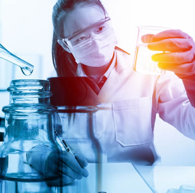 female scientist holding beaker